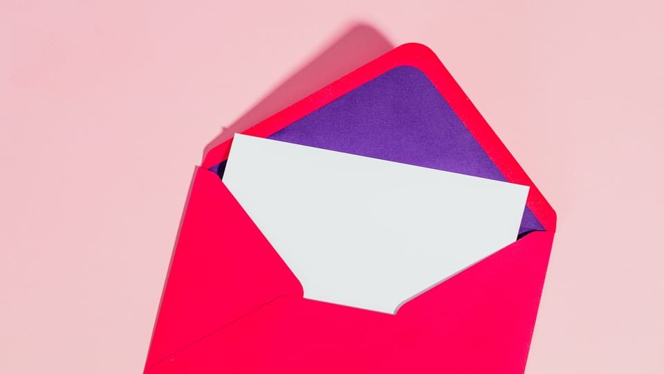 red-purple-envelope-white-paper